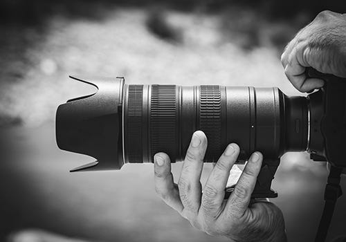 A black and white photo of a camera A black and white photo of a camera