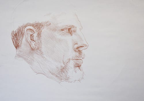 A red pencil drawing of a profile of a man by Jason Alexander A red pencil drawing of a profile of a man by Jason Alexander