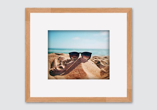 Warmer toned frames and mat boards work well with summer photography