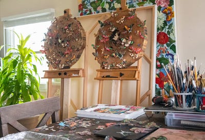 Wood logs with butterflies on easels Wood logs with butterflies on easels