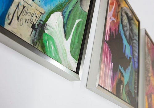 A triptych framed in a Nielsen metal picture frame A triptych framed in a Nielsen metal picture frame