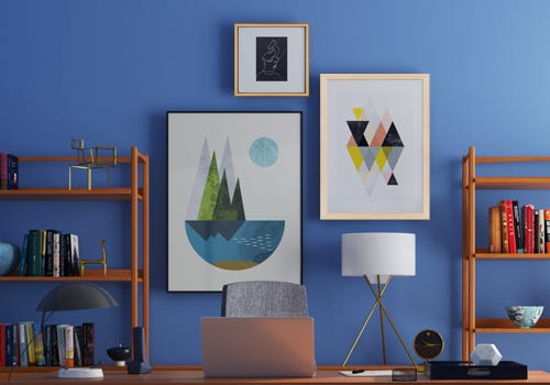 A gallery display on a blue wall