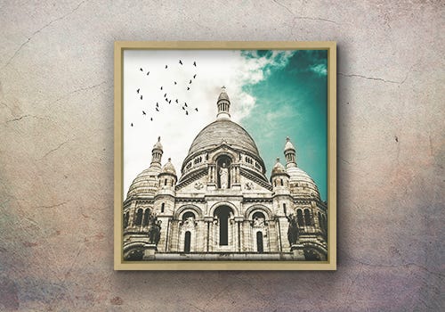 Painting of an old building with a brushed gold frame around it Painting of an old building with a brushed gold frame around it