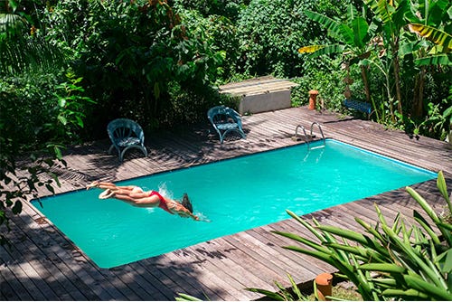 Woman diving into a pool Woman diving into a pool