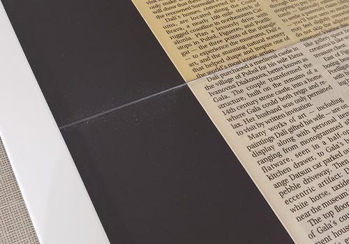 A newspaper with faded color due to light damge. A newspaper with faded color due to light damge.