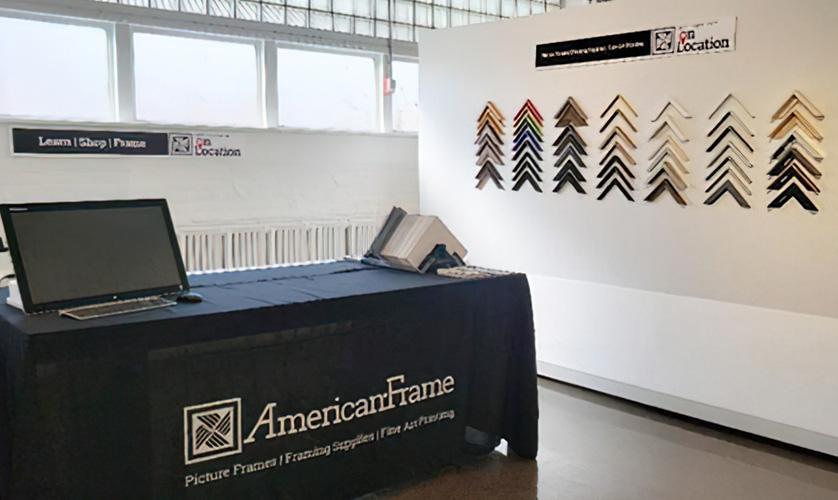 American Frame pop-up showroom with table and samples of mat board and frames