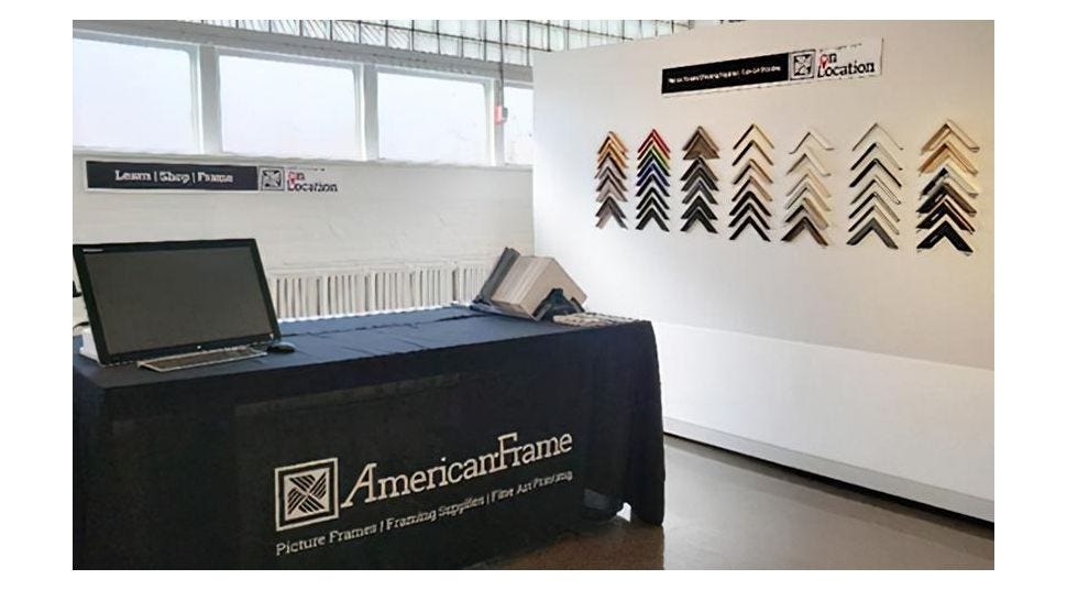 American Frame pop-up showroom with table and samples of mat board and frames