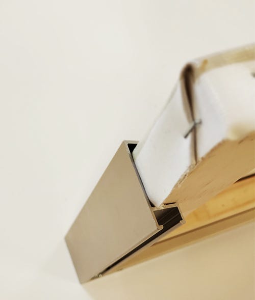 A canvas in a tight fitting metal frame A canvas in a tight fitting metal frame