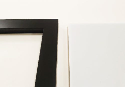 Frame and acrylic set next to each other Frame and acrylic set next to each other