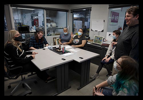 American Frame employees collaborating in our command post. American Frame employees collaborating in our command post.