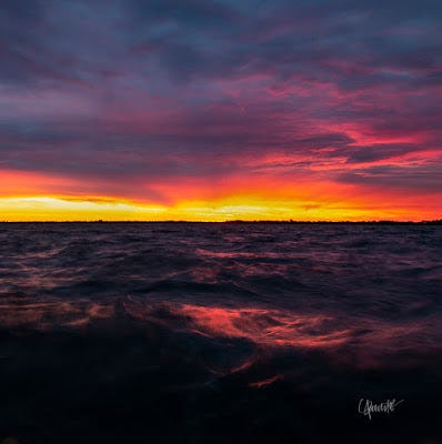 A colorful sunset over the detroit river