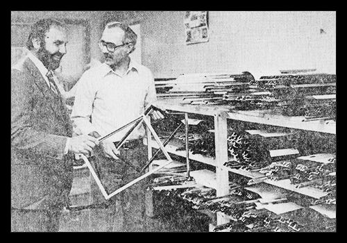 Mr. Mickel and Mr. Cromley look over assembled frames; Toledo Blade 1979 Mr. Mickel and Mr. Cromley look over assembled frames; Toledo Blade 1979