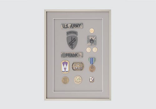 Militarymemorabilia displayed in a shdowbox Military memorabilia displayed in a shdowbox