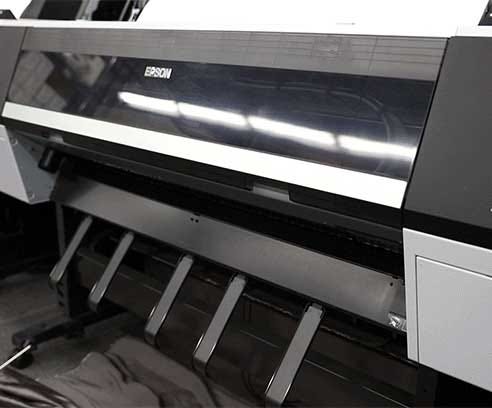 Epson SureColor wide format printer printing an image of a sunset.