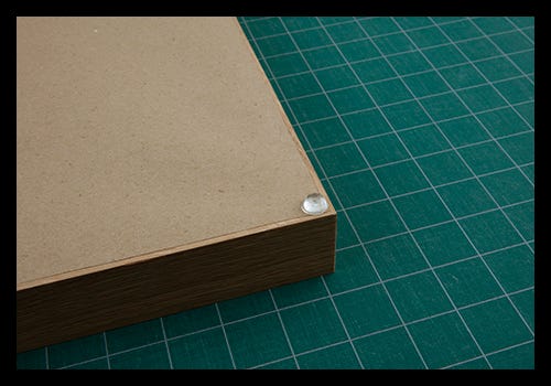 Apply bumper pads to the bottom two corners of your frame Apply bumper pads to the bottom two corners of your frame