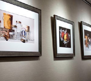 Watercolor reproductions framed in a silver wooden picture frame