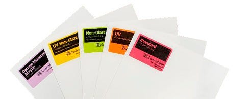 Five pieces of acrylic with a white protective paper and a neon label 