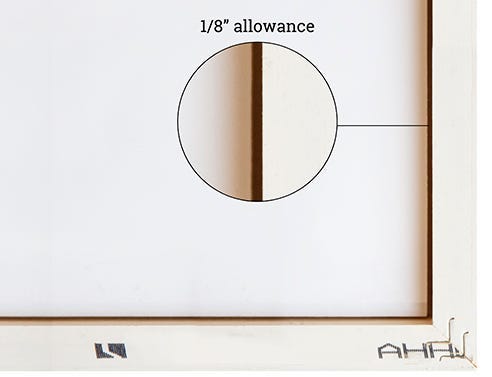 Close up view of the 1/8" space between the inside of the frame and mat board