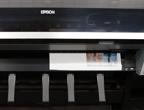 Large format Epson SureColor giclee printer printing a photograph