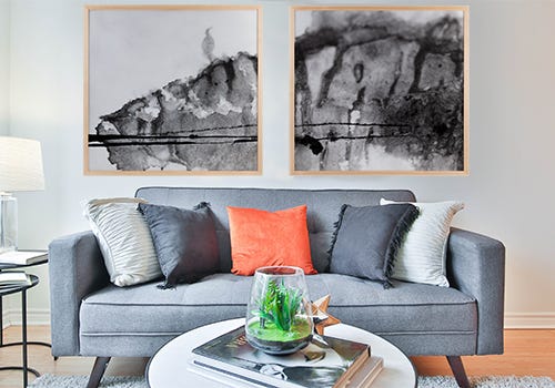 Diptych hung in living room with natural maple wooden picture frames Diptych hung in living room with natural maple wooden picture frames