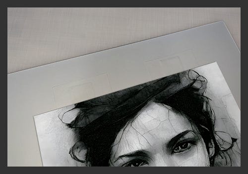 T-Hinge technique to attach a charcoal drawing to a mat board. T-Hinge technique to attach a charcoal drawing to a mat board.