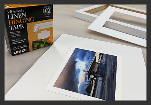 Use acid free linen tape to mount your artwork. Use acid free linen tape to mount your artwork.