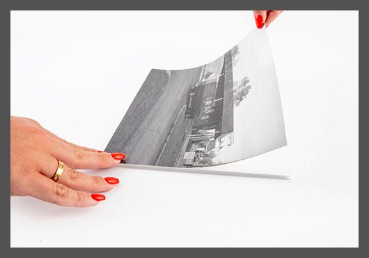 Attaching a photograph to self-adhesive mounting board Attaching a photograph to self-adhesive mounting board